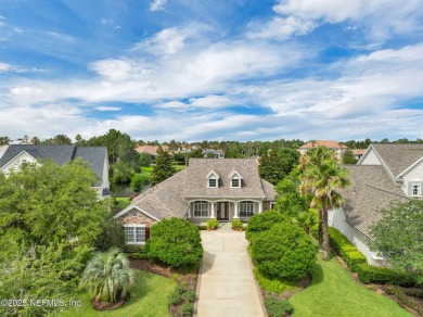 This elegant David Weekley home offers panoramic water views on The Palencia Club in Florida - for sale on GolfHomes.com, golf home, golf lot