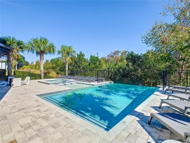 Welcome to 550 Muirfield Loop - The Epitome of Luxury in Reunion on ChampionsGate Golf Resort in Florida - for sale on GolfHomes.com, golf home, golf lot