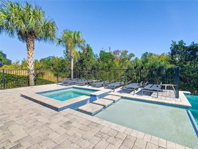 Welcome to 550 Muirfield Loop - The Epitome of Luxury in Reunion on ChampionsGate Golf Resort in Florida - for sale on GolfHomes.com, golf home, golf lot