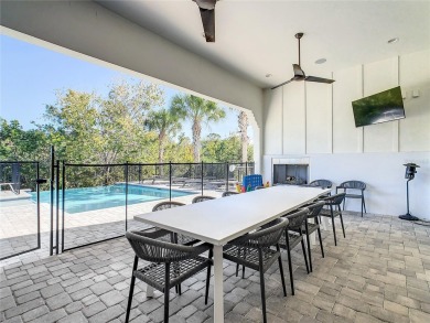 Welcome to 550 Muirfield Loop - The Epitome of Luxury in Reunion on ChampionsGate Golf Resort in Florida - for sale on GolfHomes.com, golf home, golf lot