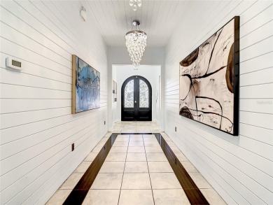 Welcome to 550 Muirfield Loop - The Epitome of Luxury in Reunion on ChampionsGate Golf Resort in Florida - for sale on GolfHomes.com, golf home, golf lot