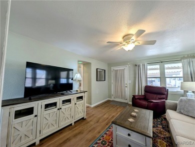 This is a beautiful home. New vinyl plank flooring in family on Riverview Golf Course in Arizona - for sale on GolfHomes.com, golf home, golf lot