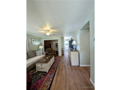 This is a beautiful home. New vinyl plank flooring in family on Riverview Golf Course in Arizona - for sale on GolfHomes.com, golf home, golf lot