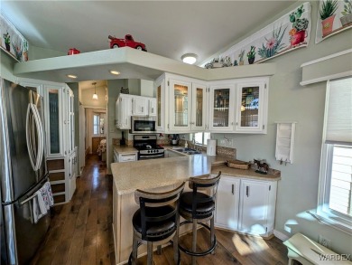 This is a beautiful home. New vinyl plank flooring in family on Riverview Golf Course in Arizona - for sale on GolfHomes.com, golf home, golf lot