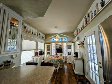 This is a beautiful home. New vinyl plank flooring in family on Riverview Golf Course in Arizona - for sale on GolfHomes.com, golf home, golf lot