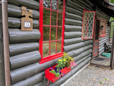 This impeccably maintained, climate-controlled, historic Log on Lucerne In Maine Golf Course in Maine - for sale on GolfHomes.com, golf home, golf lot