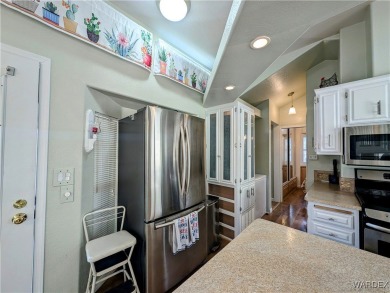 This is a beautiful home. New vinyl plank flooring in family on Riverview Golf Course in Arizona - for sale on GolfHomes.com, golf home, golf lot