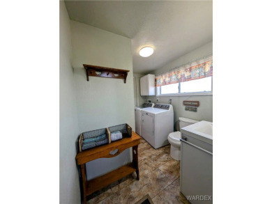 This is a beautiful home. New vinyl plank flooring in family on Riverview Golf Course in Arizona - for sale on GolfHomes.com, golf home, golf lot