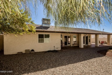 It is a quick golf cart trip down the street to the beautiful on London Bridge Golf Course in Arizona - for sale on GolfHomes.com, golf home, golf lot