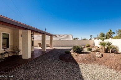 It is a quick golf cart trip down the street to the beautiful on London Bridge Golf Course in Arizona - for sale on GolfHomes.com, golf home, golf lot