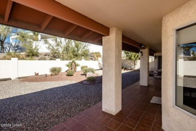 It is a quick golf cart trip down the street to the beautiful on London Bridge Golf Course in Arizona - for sale on GolfHomes.com, golf home, golf lot