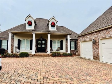 Stunning home with expansive windows overlooking the #3 fairway on Money Hill Golf and Country Club in Louisiana - for sale on GolfHomes.com, golf home, golf lot