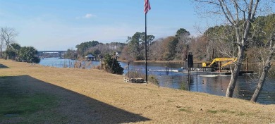 Sit on your deck and watch the boats pass by. Quiet community on Barefoot Resort and Golf Club  in South Carolina - for sale on GolfHomes.com, golf home, golf lot