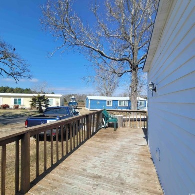 Sit on your deck and watch the boats pass by. Quiet community on Barefoot Resort and Golf Club  in South Carolina - for sale on GolfHomes.com, golf home, golf lot