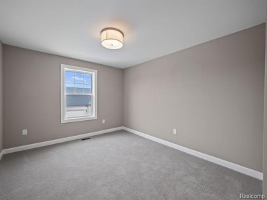 Stunning New Construction End-Unit Condo, adjacent to the on Pine Trace Golf Club in Michigan - for sale on GolfHomes.com, golf home, golf lot