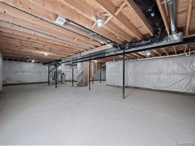 Stunning New Construction End-Unit Condo, adjacent to the on Pine Trace Golf Club in Michigan - for sale on GolfHomes.com, golf home, golf lot