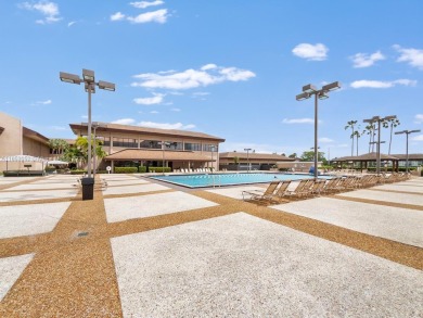 Step into this spacious first-floor unit in the highly on Flamingo Lakes Country Club in Florida - for sale on GolfHomes.com, golf home, golf lot