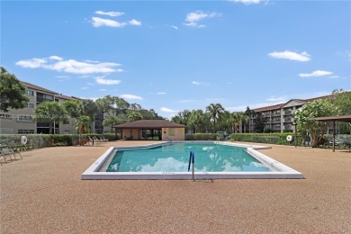 Step into this spacious first-floor unit in the highly on Flamingo Lakes Country Club in Florida - for sale on GolfHomes.com, golf home, golf lot