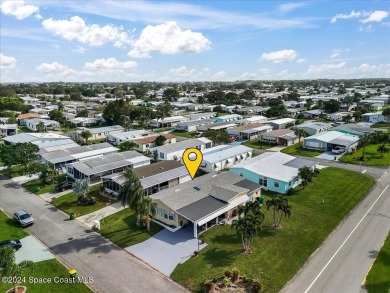 Welcome home! This 2 bed 2 bath home has over 1700 sf of living on Barefoot Bay Golf Course in Florida - for sale on GolfHomes.com, golf home, golf lot