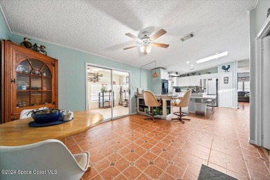 Welcome home! This 2 bed 2 bath home has over 1700 sf of living on Barefoot Bay Golf Course in Florida - for sale on GolfHomes.com, golf home, golf lot