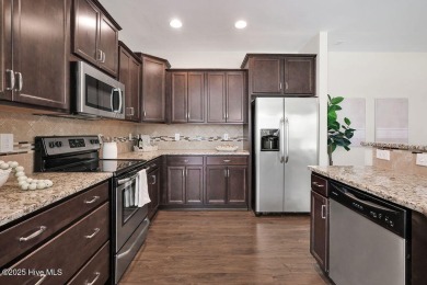 Welcome to this impeccably maintained 4-bedroom home nestled in on Beau Rivage Golf and Resort in North Carolina - for sale on GolfHomes.com, golf home, golf lot