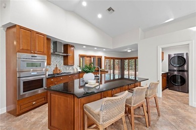 Set on an oversized golf-course lot with eastern rear exposure on Wildcat Run Golf and Country Club in Florida - for sale on GolfHomes.com, golf home, golf lot