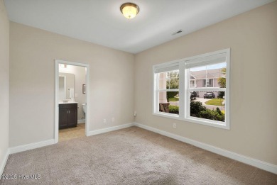 Welcome to this impeccably maintained 4-bedroom home nestled in on Beau Rivage Golf and Resort in North Carolina - for sale on GolfHomes.com, golf home, golf lot