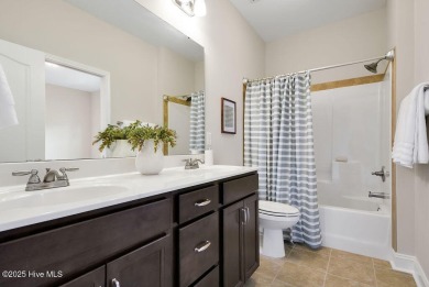 Welcome to this impeccably maintained 4-bedroom home nestled in on Beau Rivage Golf and Resort in North Carolina - for sale on GolfHomes.com, golf home, golf lot