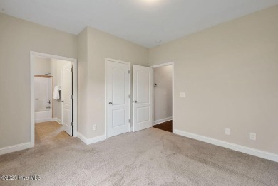Welcome to this impeccably maintained 4-bedroom home nestled in on Beau Rivage Golf and Resort in North Carolina - for sale on GolfHomes.com, golf home, golf lot