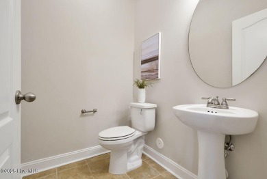 Welcome to this impeccably maintained 4-bedroom home nestled in on Beau Rivage Golf and Resort in North Carolina - for sale on GolfHomes.com, golf home, golf lot
