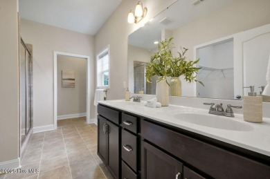 Welcome to this impeccably maintained 4-bedroom home nestled in on Beau Rivage Golf and Resort in North Carolina - for sale on GolfHomes.com, golf home, golf lot