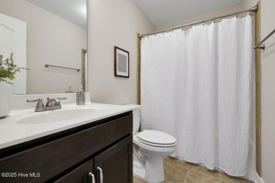 Welcome to this impeccably maintained 4-bedroom home nestled in on Beau Rivage Golf and Resort in North Carolina - for sale on GolfHomes.com, golf home, golf lot