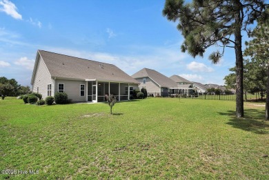 Welcome to this impeccably maintained 4-bedroom home nestled in on Beau Rivage Golf and Resort in North Carolina - for sale on GolfHomes.com, golf home, golf lot