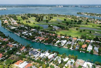 Live in the coveted gated Normandy Shores boasting a premier on Normandy Shores Golf Course in Florida - for sale on GolfHomes.com, golf home, golf lot