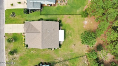 Welcome to this impeccably maintained 4-bedroom home nestled in on Beau Rivage Golf and Resort in North Carolina - for sale on GolfHomes.com, golf home, golf lot