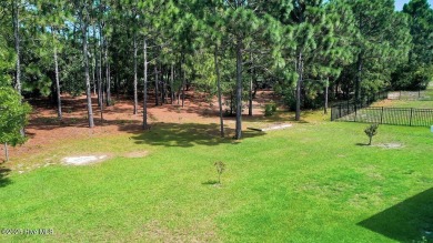 Welcome to this impeccably maintained 4-bedroom home nestled in on Beau Rivage Golf and Resort in North Carolina - for sale on GolfHomes.com, golf home, golf lot