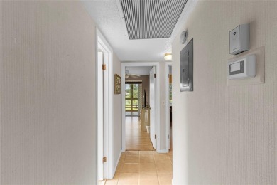LOCATION LOCATION!!! HIGHLY DESIRABLE CORNER UNIT ON THE TOP on Hillsboro Pines Golf in Florida - for sale on GolfHomes.com, golf home, golf lot