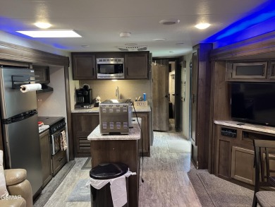Nice RV lot with plenty of trees, nice patio, and firepit area on Bent Creek Golf Course in Tennessee - for sale on GolfHomes.com, golf home, golf lot