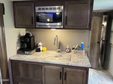 Nice RV lot with plenty of trees, nice patio, and firepit area on Bent Creek Golf Course in Tennessee - for sale on GolfHomes.com, golf home, golf lot