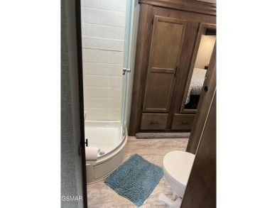 Nice RV lot with plenty of trees, nice patio, and firepit area on Bent Creek Golf Course in Tennessee - for sale on GolfHomes.com, golf home, golf lot