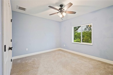 Tucked away on a spacious private lot in the guard gated on Lake Jovita Golf and Country Club in Florida - for sale on GolfHomes.com, golf home, golf lot