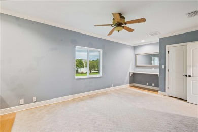 Tucked away on a spacious private lot in the guard gated on Lake Jovita Golf and Country Club in Florida - for sale on GolfHomes.com, golf home, golf lot
