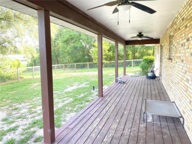 BUYERS FINANCING FELL THROUGH....HUGE 2,590 sf Brick two-story on Williston Highlands Golf and Country Club in Florida - for sale on GolfHomes.com, golf home, golf lot