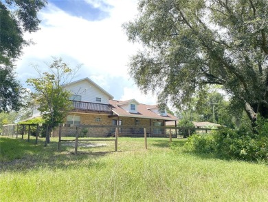 BUYERS FINANCING FELL THROUGH....HUGE 2,590 sf Brick two-story on Williston Highlands Golf and Country Club in Florida - for sale on GolfHomes.com, golf home, golf lot