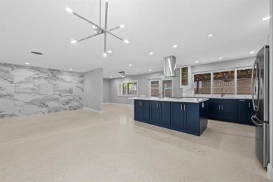 TOTALLY REMODELED 3/2 WITH 1 CAR GARAGE LOCATED RIGHT ACROSS THE on Eco Golf Club in Florida - for sale on GolfHomes.com, golf home, golf lot