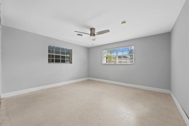 TOTALLY REMODELED 3/2 WITH 1 CAR GARAGE LOCATED RIGHT ACROSS THE on Eco Golf Club in Florida - for sale on GolfHomes.com, golf home, golf lot