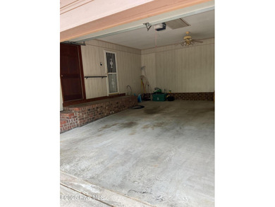 Welcome to this charming split-level home situated on the 18th on Wilson Country Club in North Carolina - for sale on GolfHomes.com, golf home, golf lot