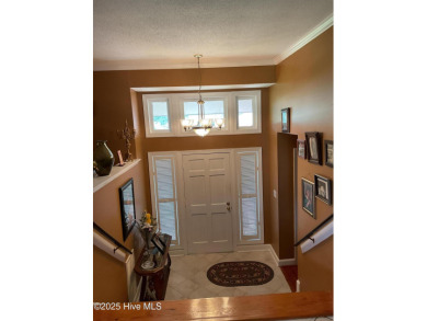 Welcome to a two story, roomy home with a lot of cozy living on Wilson Country Club in North Carolina - for sale on GolfHomes.com, golf home, golf lot