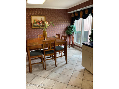 Welcome to this charming split-level home situated on the 18th on Wilson Country Club in North Carolina - for sale on GolfHomes.com, golf home, golf lot