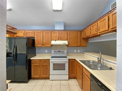 Experience the ease of low maintenance living in this bright and on Meadowbrook Golf Club in Florida - for sale on GolfHomes.com, golf home, golf lot